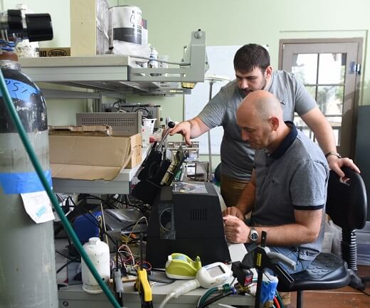Two lumen employees working in a lab